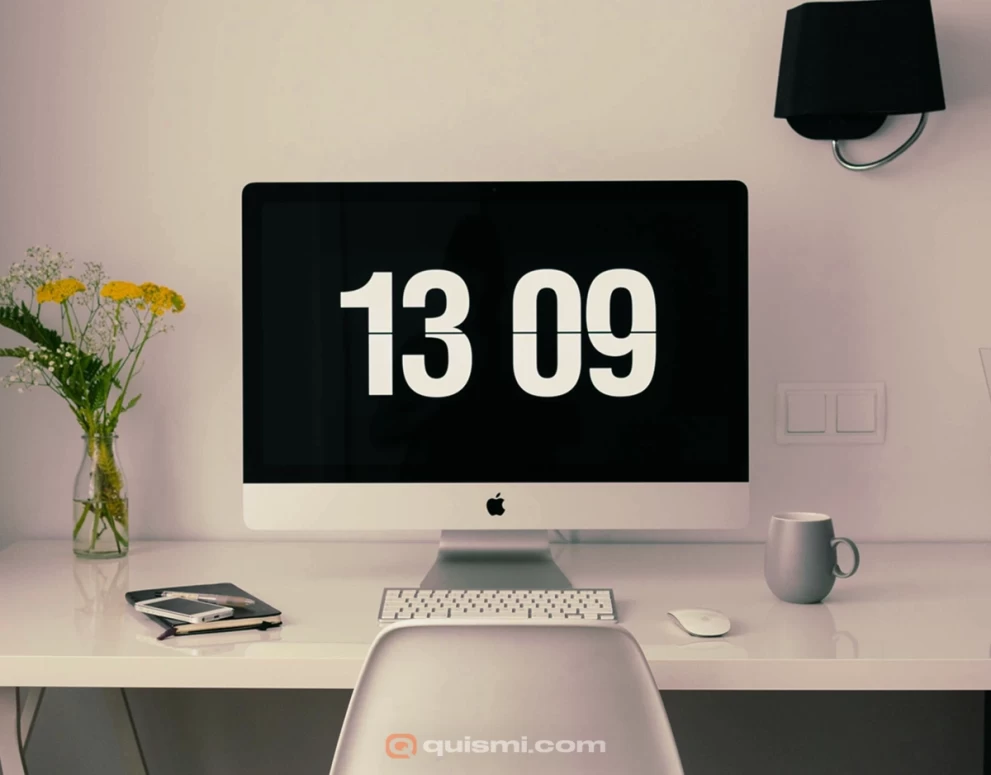 Clean white flip clock displaying time on dark Mac desktop background.