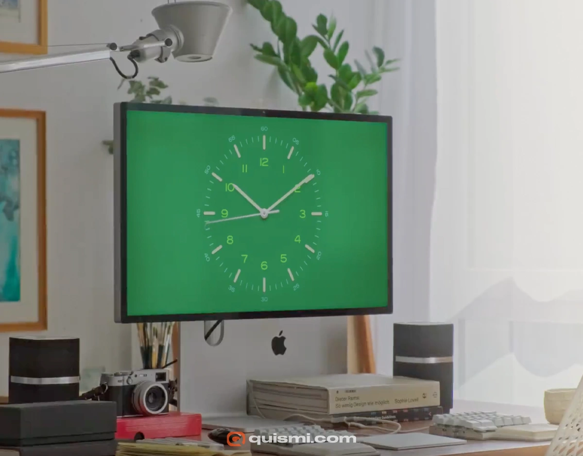 Clean minimalist clock screensaver showing time and date on Mac desktop.